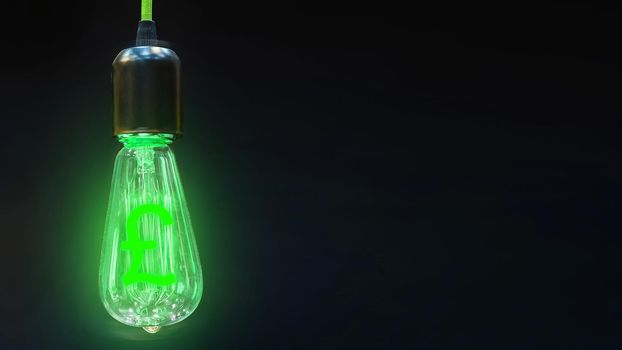 The concept of exchange rates growth pounds. Money making idea. Light bulb with Pound sterling  symbol.