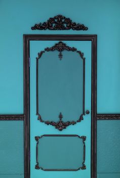 Old dramatic blue doors on the background of the wall.