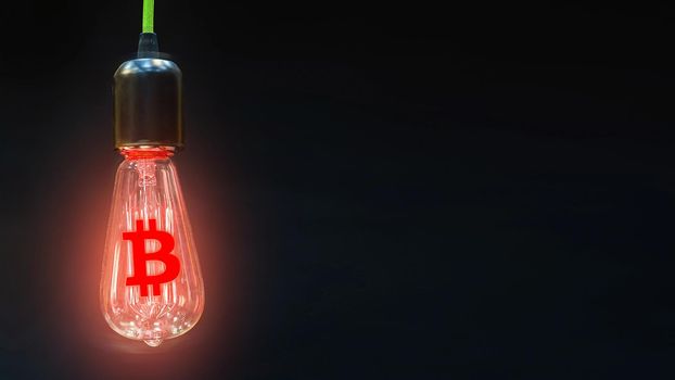 The concept of falling currency rates bitcoin. The sign of the crypto bitcoin currency is inside of the retro lamps.