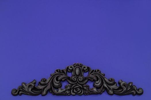 Vintage royal silver horizontal background with black ornaments on a violet wall