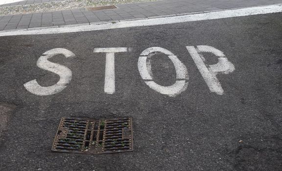 Regulatory signs, stop traffic sign on tarmac