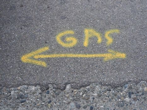 gas pipe arrow sign painted on tarmac