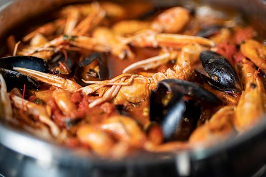 detail of fish soup with sauce during cooking