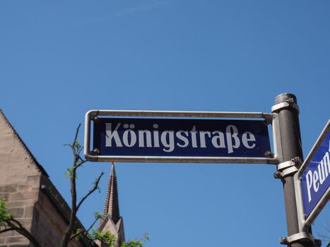 Koenigstrasse translation King Street sign over blue sky