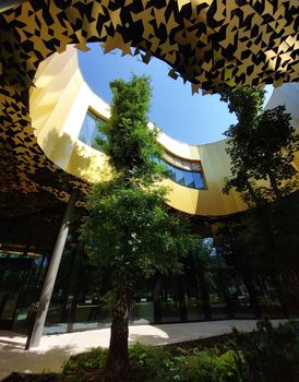 Budapest, Hungary - House of Hungarian music. Detail leafy tree in architecture.