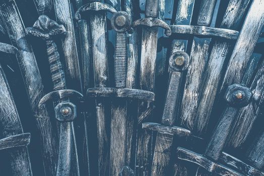 Metal knight swords background. Close up