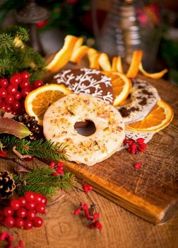 Christmas decoration with cookies and spices on an old wooden background.