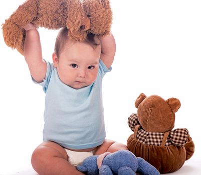 Sweet child with teddy bears isolated on white