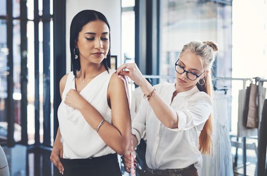 I dont trust any designer but her. a fashion designer taking her clients measurements in her workshop