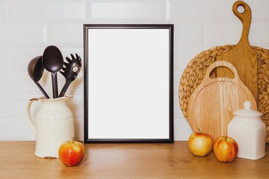 mockup in vintage style. the concept of natural cuisine and healthy food. Black frame with white sheet of paper, wooden boards for bread, fruit and ceramic utensils, flowers, copy paste