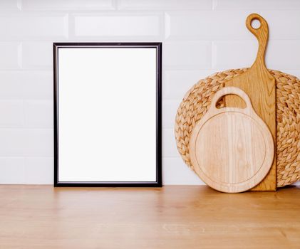 mockup in vintage style. the concept of natural cuisine and healthy food. Black frame with a white sheet of paper, wooden boards for bread, fruits and ceramic utensils, copy paste