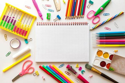 Blank notebook with School office supplies on a desk with copy space. Back to school concept.