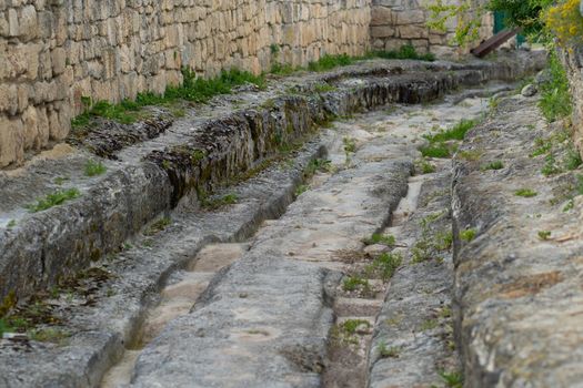 Ancient city road chufut bakhchisaray cave crimea medieval fortress monument, for landscape building in historic from rock cloudy, mountain karaite. View ruins stony,