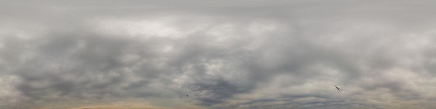 Sky panorama on overcast rainy day with low clouds in seamless spherical equirectangular format. Complete zenith for use in 3D graphics, game and for aerial drone 360 degree panorama as a sky dome.