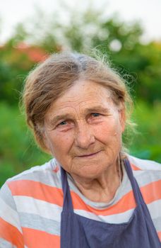 Portrait of a grandmother in the garden. selective focus. People.