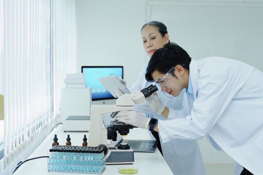 medical research laboratories, scientists analyze chemical samples Discuss technological innovations. Advanced scientific laboratories for medicine, biotechnology
