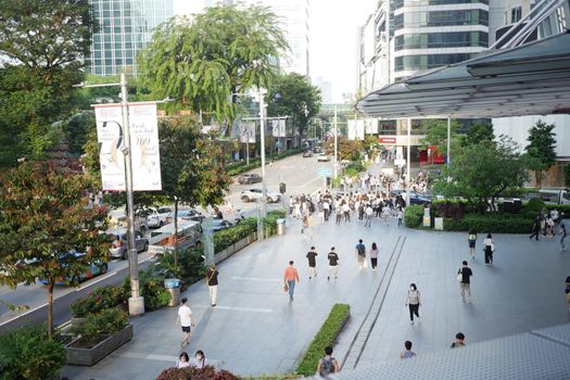 group of people walking together in Marina Bay