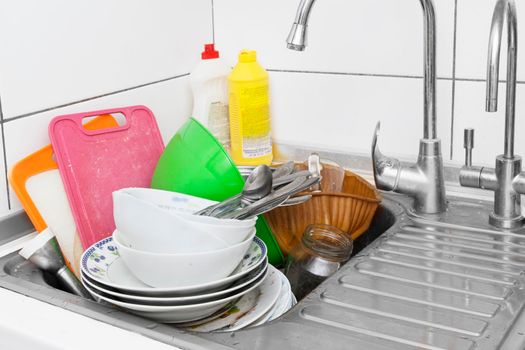 Dirty dishes in the kitchen sink. Handwashing dishes concept. High quality photo