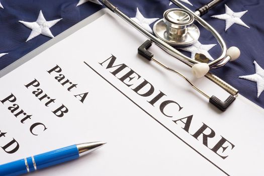 Medicare papers with different parts and a flag.