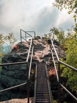 Ladder to Schrammstein rocks viewpoint in Saxon Switzerland park. Schrammstein rocks aussicht, Saxony, Germany