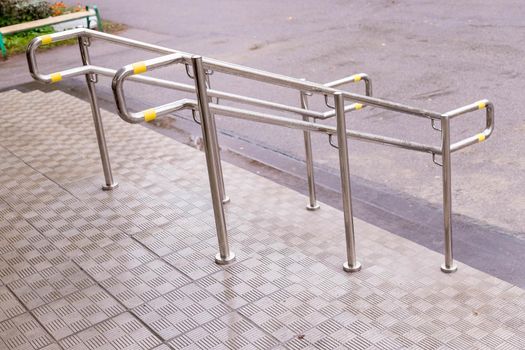 Stainless steel handrails are installed on the walls and steps.