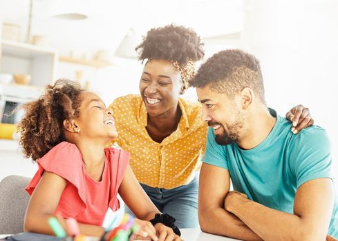 Family with daughter having fun at home