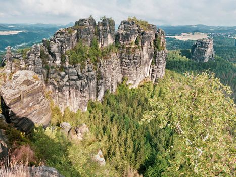 Panoramic view of sharp Schrammsteine and landscape in Saxon Switzerland park on hiking trail Germany