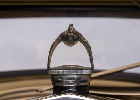 Ketchikan, AK - 10 June 2022: Flying quail or bird as hood radiator ornament on Model A vintage car