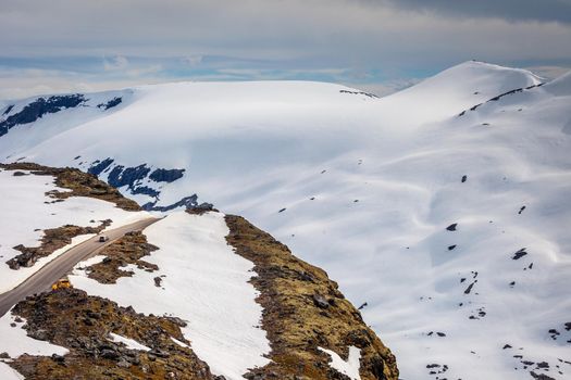 Country road with wall of ice and snow in Vestland mountains, Norway, Scandinavia