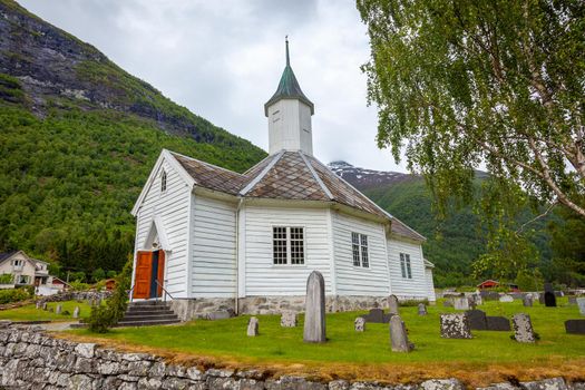 Bakka wooden catholic Church and tombstones in Aurland, Norway, Scandinavia