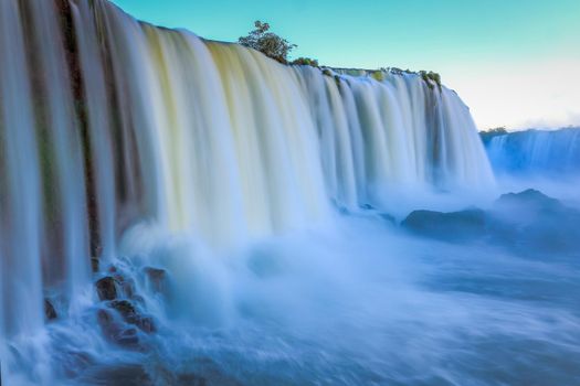 Iguacu falls in southern Brazil at dawn, long exposure and blurred waters, South America