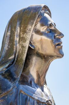 Virgin Mary praying with hands clasped for faith and hope of better days to come