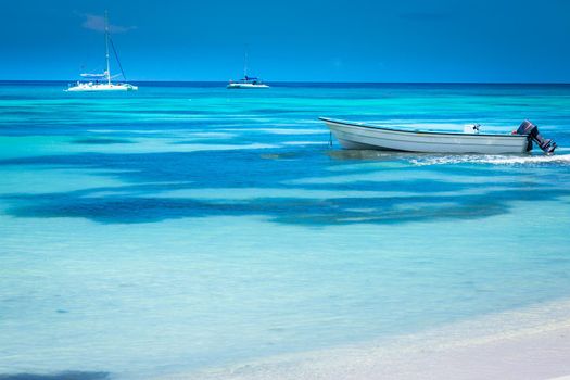 Tropical paradise: idyllic caribbean beach with sailboats, Punta Cana, Dominican Republic