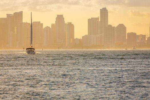 Miami sea habor at golden sunset with american flag, Florida, United States