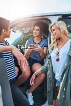 Give me the destination and my phone will take us there. girlfriends out on a road trip together