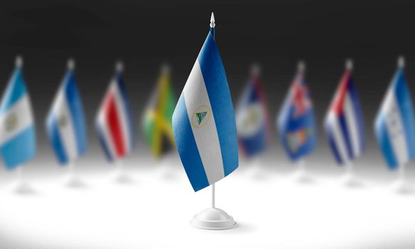 The national flag of the Nicaragua on the background of flags of other countries.