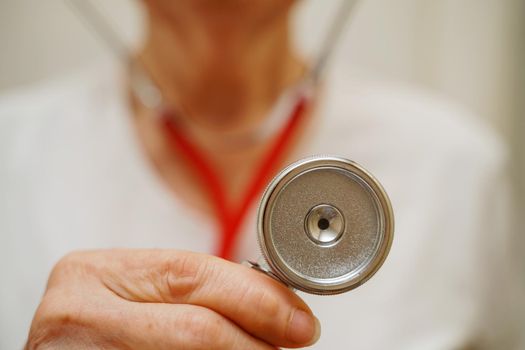 Medical background doctor stethoscope. Happy nurse in hospital uniform, hands with stethoscope isolated on white. Medical care and healthcare concept.