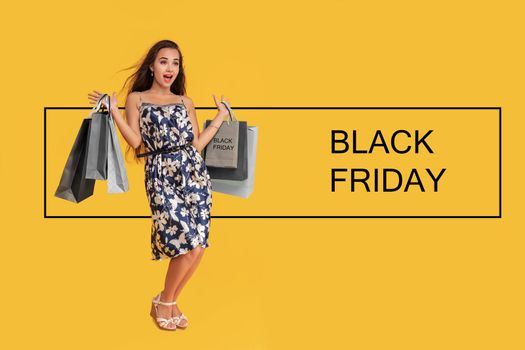 Shopping and sale. Fashion and beauty, shopaholic girl. Black Friday, holiday celebration. Woman with happy face hold shopping bag on yellow background. Girl with long hair hold present pack, cyber Monday.