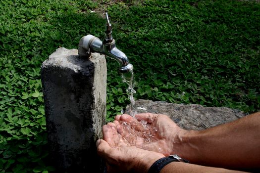 salvador, bahia / brazil - november 9, 2013: leaky faucet is seen in the city of Salvador.