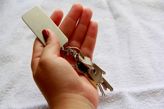 salvador, bahia / brazil - november 10, 2013: hand holds house key in the city of Salvador.