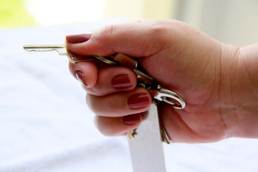 salvador, bahia / brazil - november 10, 2013: hand holds house key in the city of Salvador.