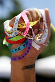 salvador, bahia / brazil - january 15, 2015: person is seen holding tapes of Senhor do Bonfim during religious procession in the church in the city of Salvador.