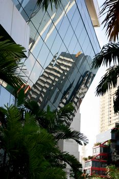 salvador, bahia / brazil - september 23, 2015: reflections of the street are seen in a mirrored building in the city of Salvador.