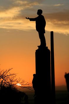 salvador, bahia / brazil - january 11, 2016: the poet Castro Alves's status is seen during sunset at Baia de Todos os Santos in the city of Salvador.