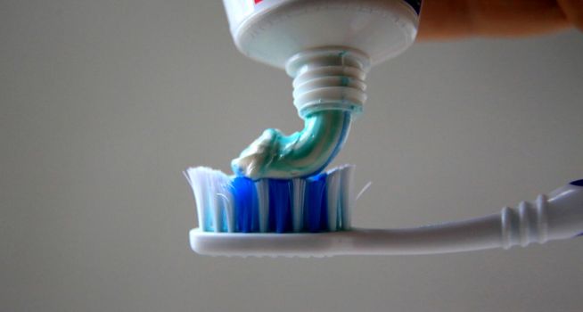 salvador, bahia / brazil - may 5, 2020: toothpaste is seen with a toothbrush in the city of Salvador.