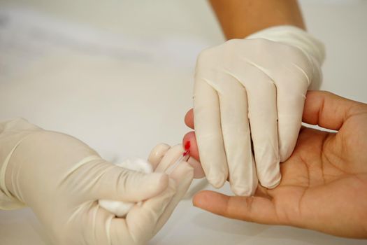 salvador, bahia, brazil - july 28, 2017: blood is collected from a patient to perform rapid tests for the diagnosis of Hepatitis B and C in the city of Salvador.
