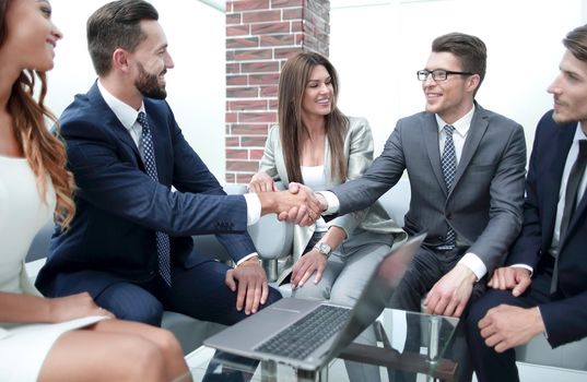 handshake business people at an informal meeting. the concept of cooperation