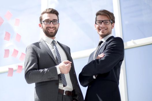 two successful business people standing in the office.business concept