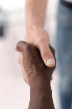 close up. handshake between two business partners .the concept of cooperation