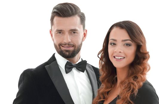 Portrait of a beautiful young man and woman dressed in classic clothes, studio shot over white background